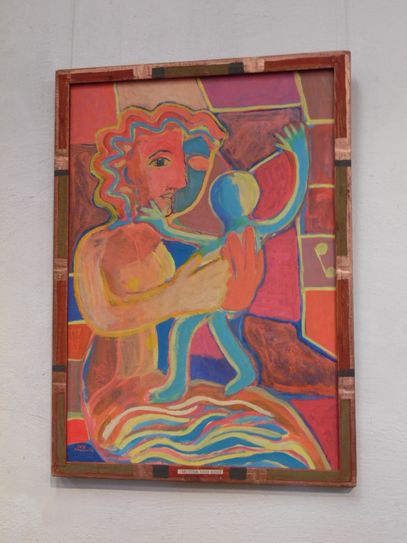Dieses Bild heißt „Mutter und Kind“ mit einem kunstvoll gestalteten Rahmen.