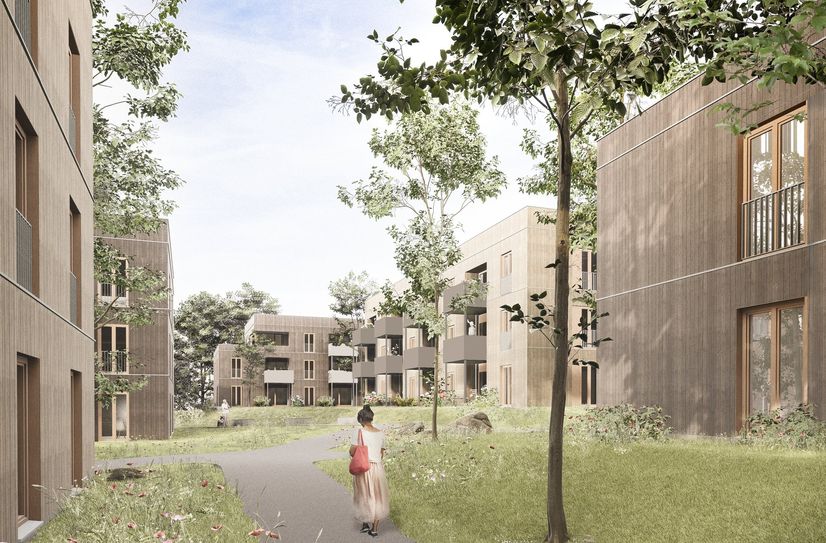 In zwei Bauabschnitten entstehen neun seriell vorgefertigte Gebäude in Holz-Hybrid-Bauweise.